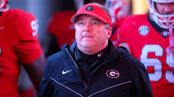 Georgia Bulldogs head coach Kirby Smart walks on the field before a game against the Mississippi Rebels at Sanford Stadium.